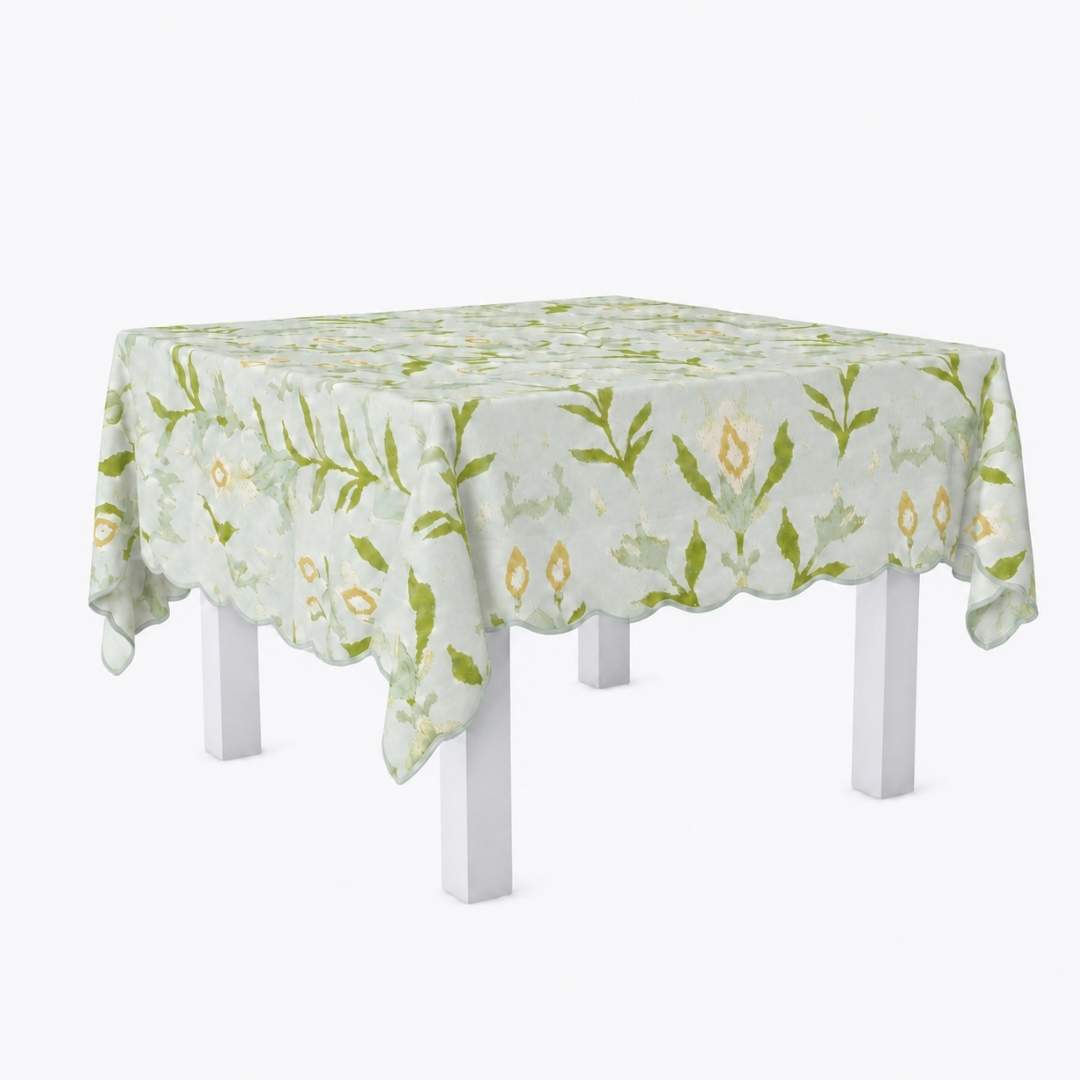 Square scalloped game tablecloth on a white table with petal garden aqua pattern by Laura Park for a card table, game table, mahjong table. 