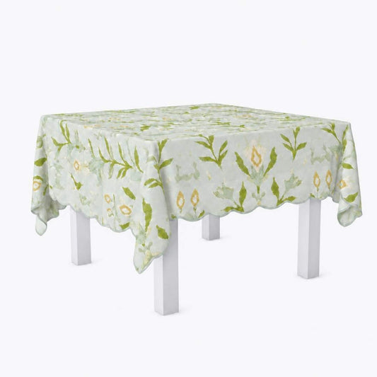Square scalloped game tablecloth on a white table with petal garden aqua pattern by Laura Park for a card table, game table, mahjong table. 