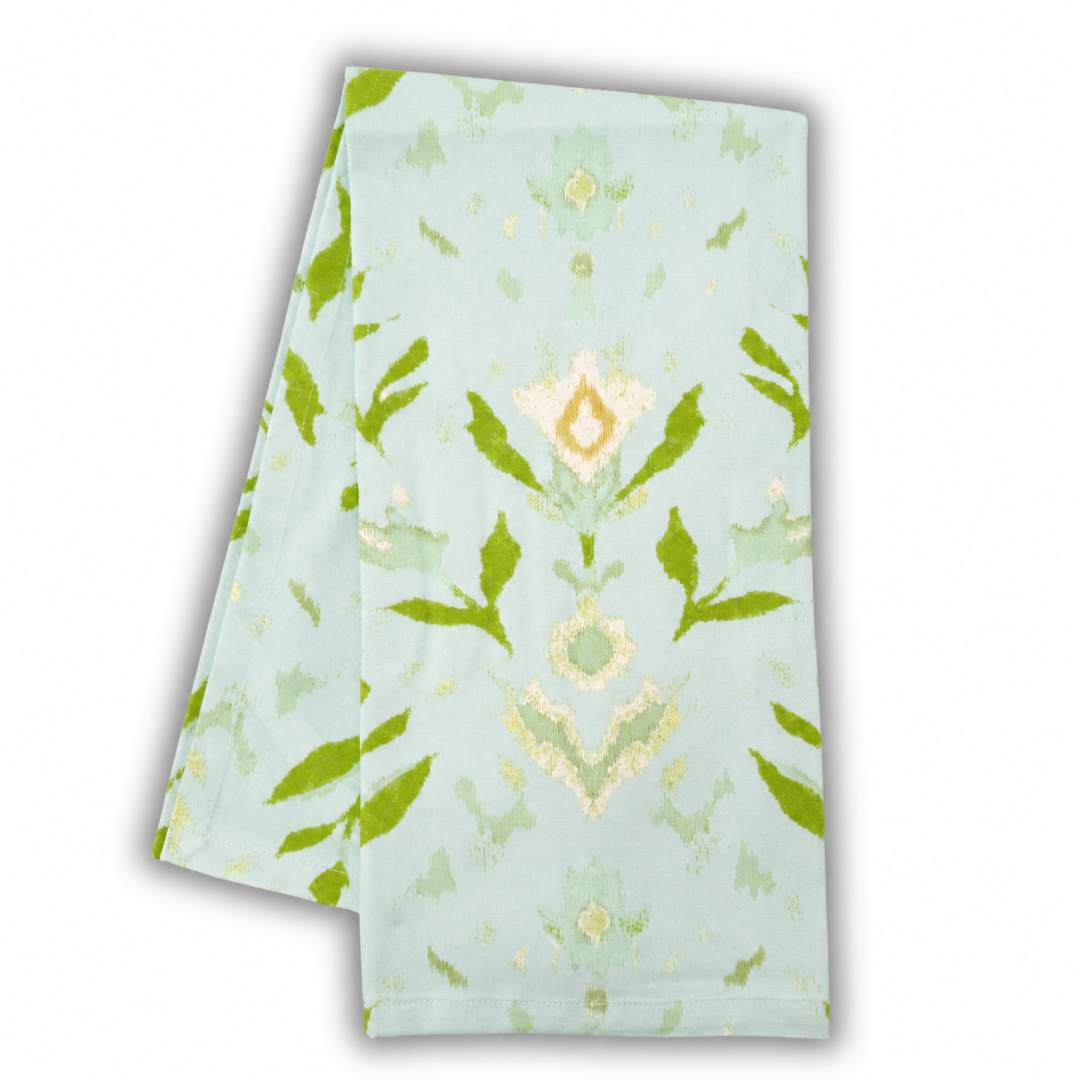 Green, aqua, and off white floral and leaf pattern hand painted pattern on a tea towel, ideal for kitchens or powder rooms. 