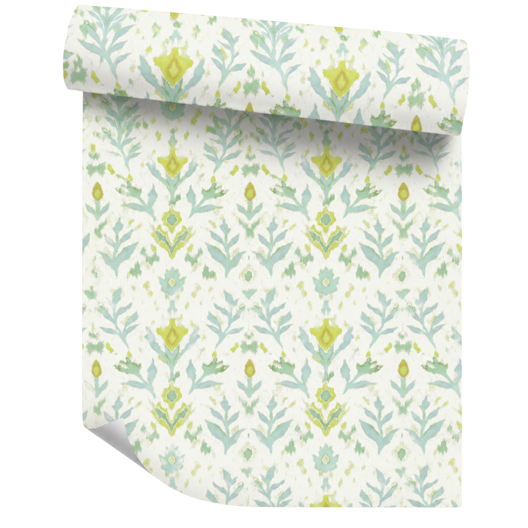 Roll of floral patterned wallpaper with green and blue floral motifs handpainted on a white background by Laura Park Designs. 