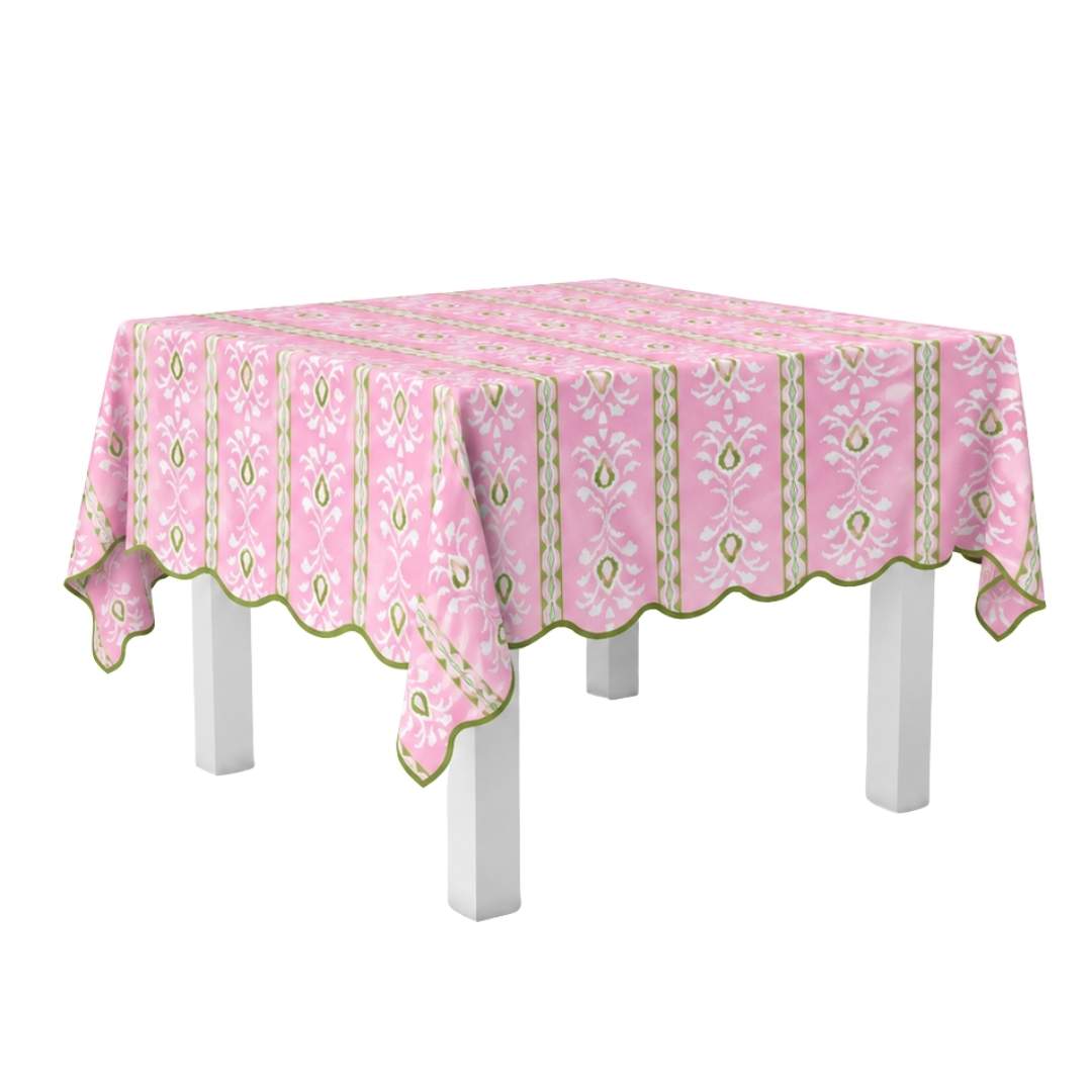 Laura Park Rosemary Stripe Pink tablecloth with green aand white floral pattern and a green scalloped edge on a white table with a white background. 
