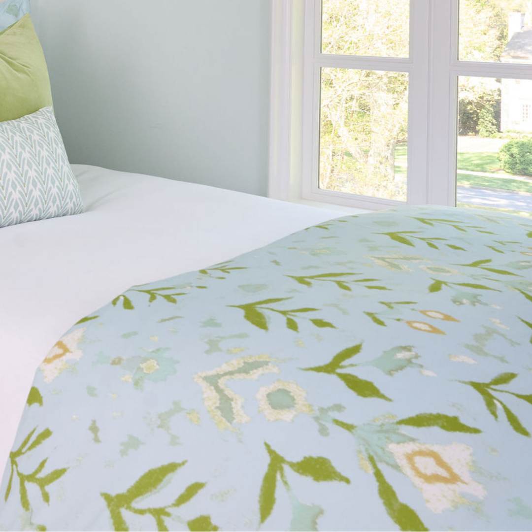 Petal Garden Aqua printed bedding by Laura Park — floral motifs on a solid aqua background, machine washable Microlux fabric.